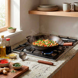 Colher Wok em Aço Inoxidável com Cabo de Madeira Colher Wok em Aço Inoxidável com Cabo de Madeira Doca